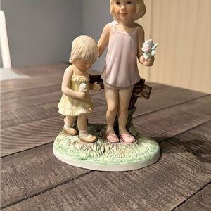 Porcelain Figurine of Two Girls in Pastel Pink and Yellow